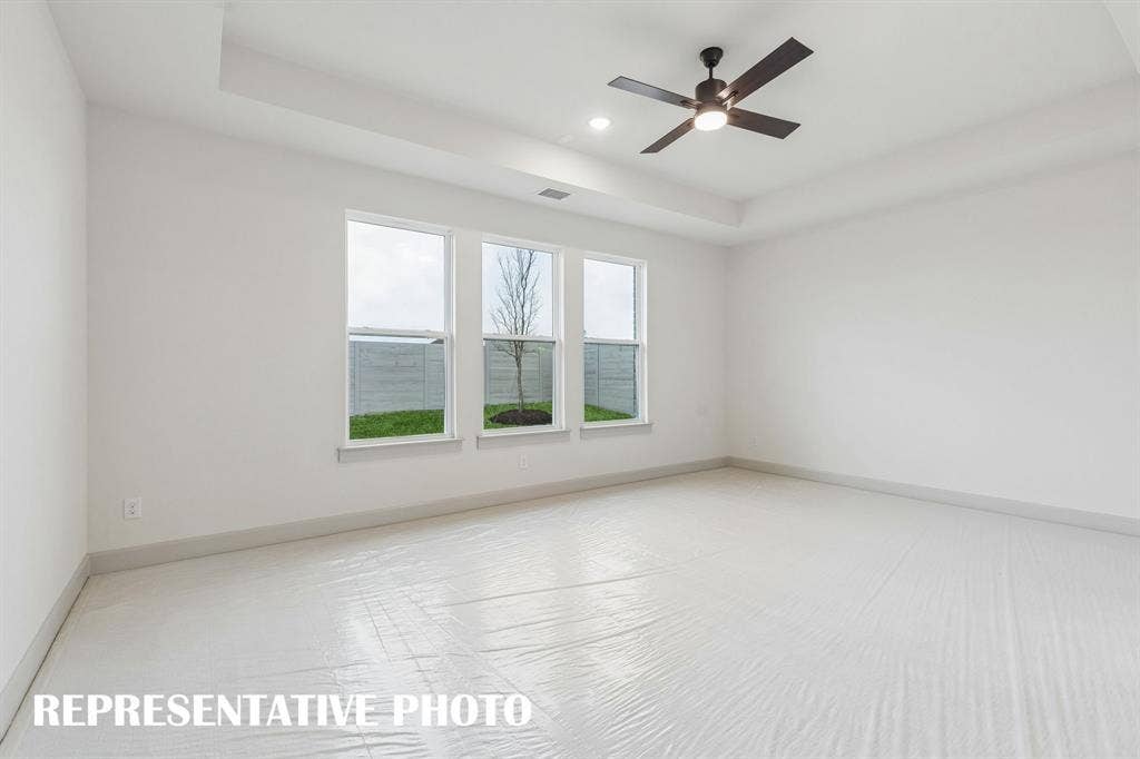 2625 Radiant Way, Celina, TX 75009 High ceilings, plush carpet and oversized windows create a peaceful and relaxing owner's suite. REPRESENTATIVE PHOTO