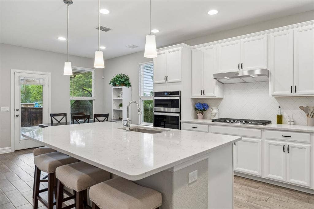 2335 Whitney Lane, Wylie, TX 75098 Clean and crisp transitional decor with a huge island for culinary preparation