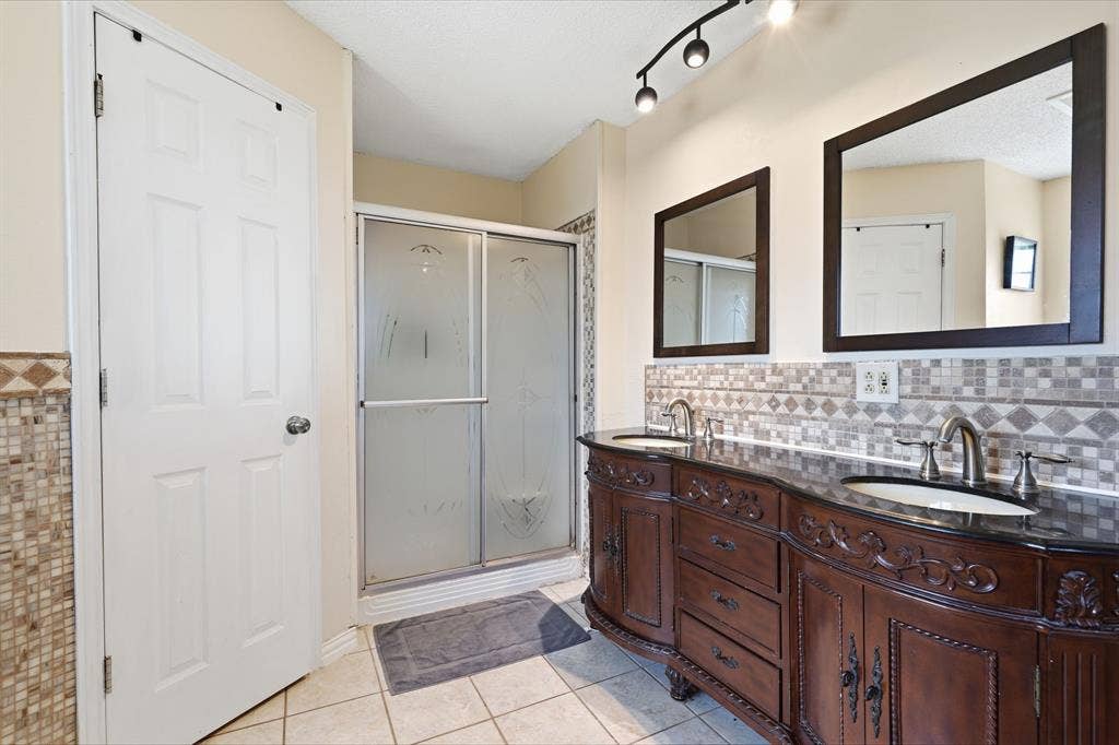 8204 Lara Lane, Watauga, TX 76148 Ensuite bathroom has walk-in Shower, garden Tub and TWO Closets