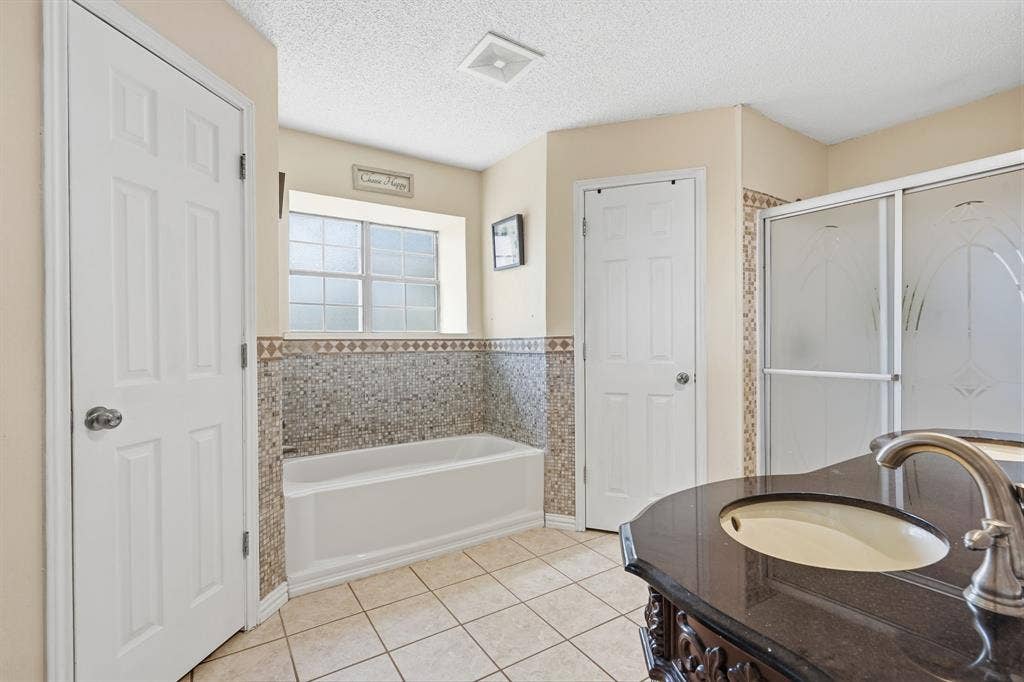 8204 Lara Lane, Watauga, TX 76148 Ensuite bathroom has walk-in Shower, garden Tub and TWO Closets