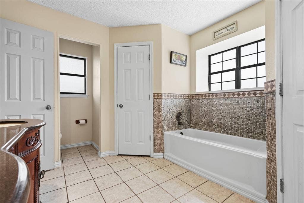 8204 Lara Lane, Watauga, TX 76148 Ensuite bathroom has walk-in Shower, garden Tub and TWO Closets