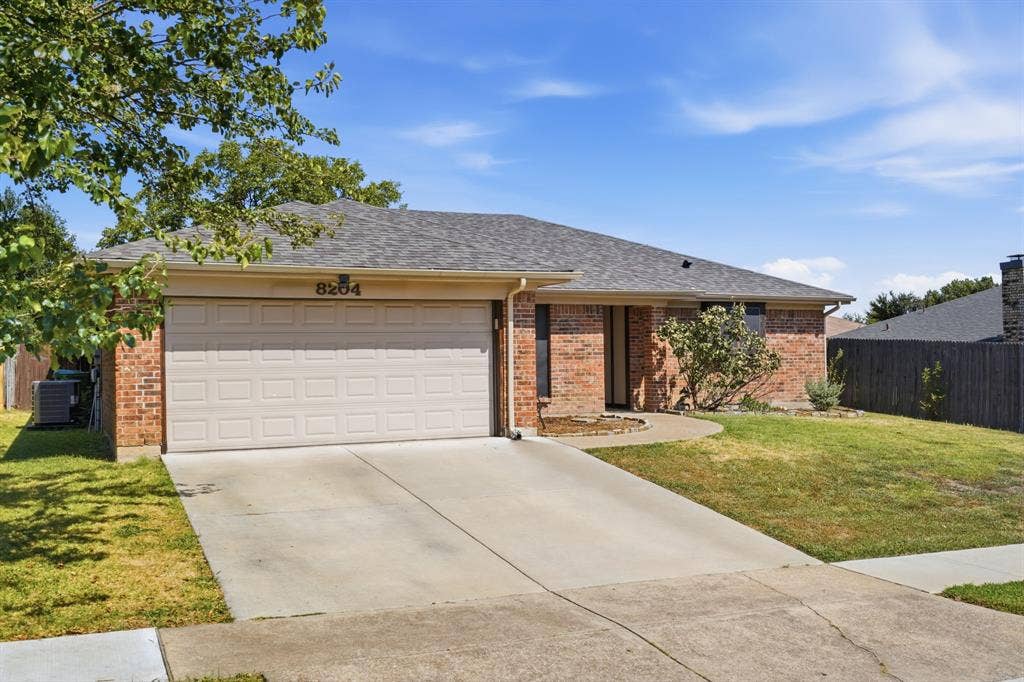 8204 Lara Lane, Watauga, TX 76148 Two Car Garage and newer Driveway