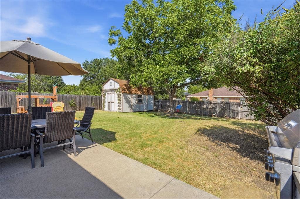 8204 Lara Lane, Watauga, TX 76148 Enjoy the outdoors under the shade of this mature tree, large patio for BBQs