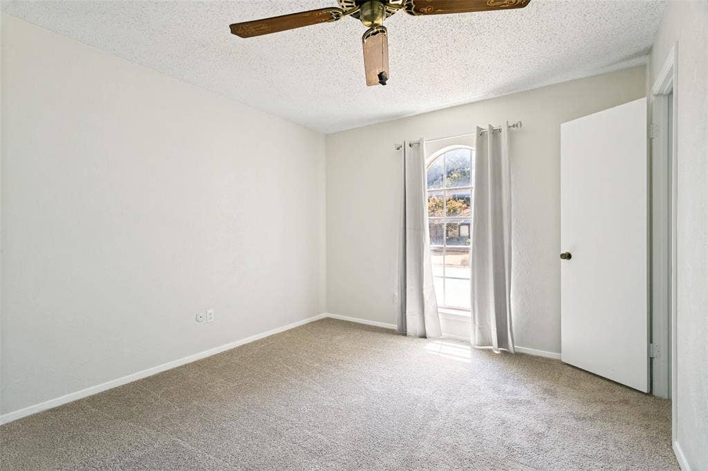 The third bedroom features brand-new carpet.