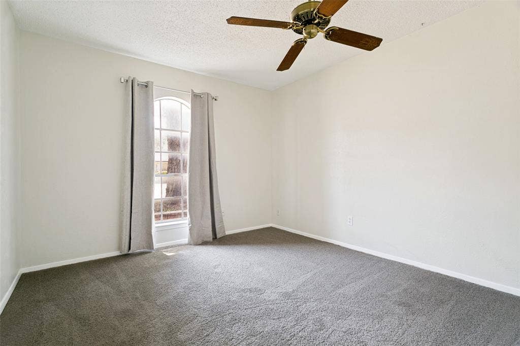 The second bedroom features brand-new carpet. Perfect for a guest room or home office.