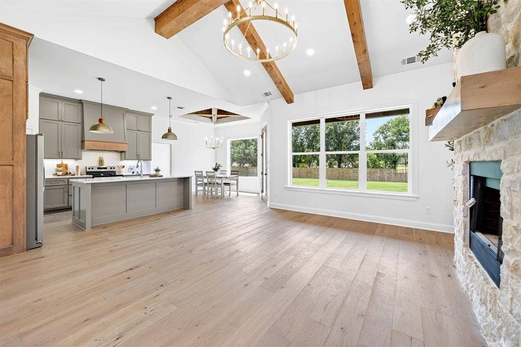 302 Grace Lane, Athens, TX 75751 Welcome to 302 Grace Lane, Athens Tx featuring engineered hardwood floors throughout, a soaring stone woodburning fireplace & 16' ceilings in the living area to give the home a welcoming but cozy feel.