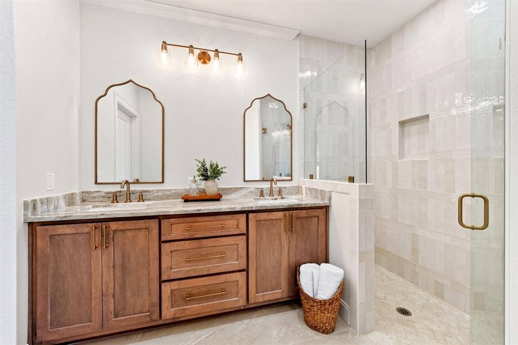 305 Grace Lane, Athens, TX 75751 Dual vanity featuring wood cabinetry and light-toned countertops