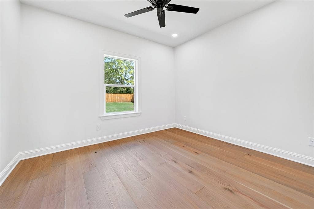 305 Grace Lane, Athens, TX 75751 Vaulted ceiling with exposed wood beams, stone fireplace, wood-finish flooring, and recessed lighting