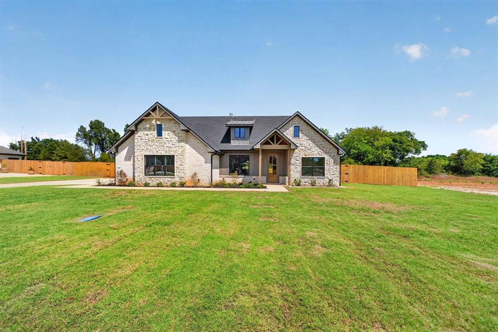 305 Grace Lane, Athens, TX 75751 Stone and brick exterior with dark trim windows
