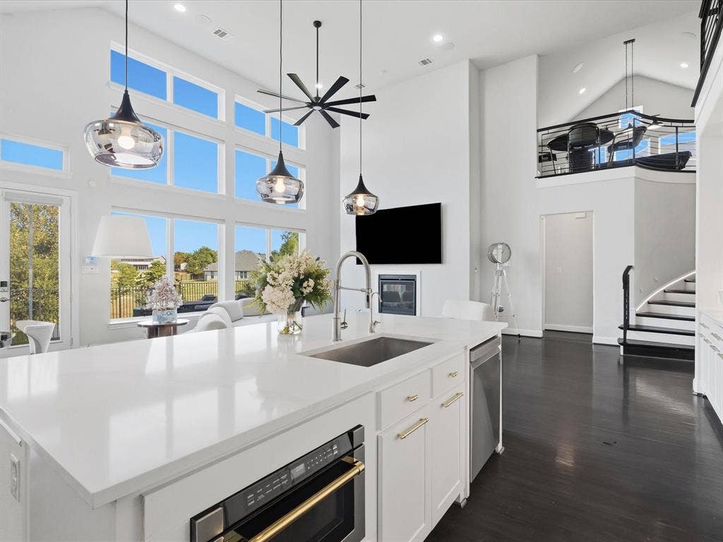 3505 Wycliff Avenue, McKinney, TX 75071 Spacious kitchen with a large island featuring a stainless steel sink and integrated microwave