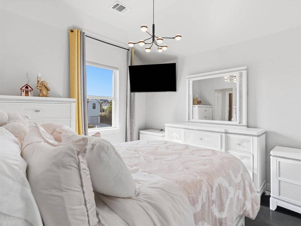 3505 Wycliff Avenue, McKinney, TX 75071 Recessed lighting, contemporary chandelier, large window, dark flooring, built-in wall mirror
