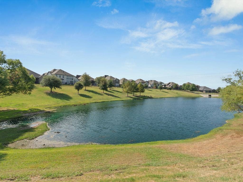 3505 Wycliff Avenue, McKinney, TX 75071 Lush green landscaping with a prominent pond