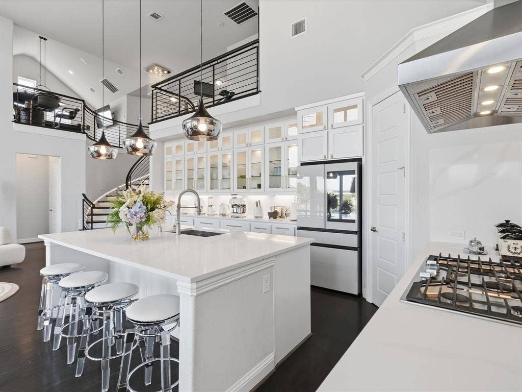 3505 Wycliff Avenue, McKinney, TX 75071 Kitchen featuring a white countertop island, pendant lighting, white cabinetry, integrated refrigerator, and gas cooktop