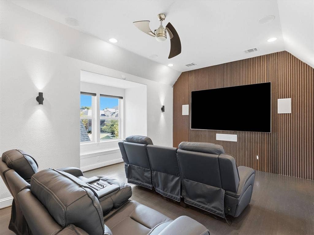 3505 Wycliff Avenue, McKinney, TX 75071 Hardwood flooring, slatted wood accent wall, recessed lighting, ceiling fan, and built-in speakers