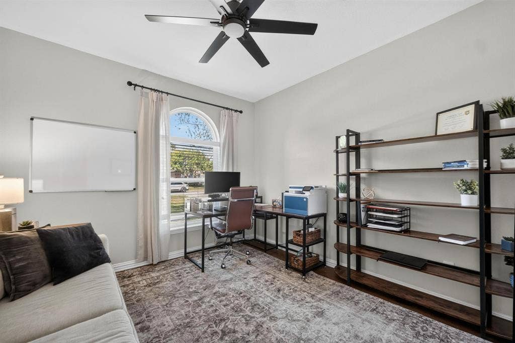 4016 Stone Haven Drive, Garland, TX 75043 Room featuring a ceiling fan with integrated lighting, an arched window and closet.