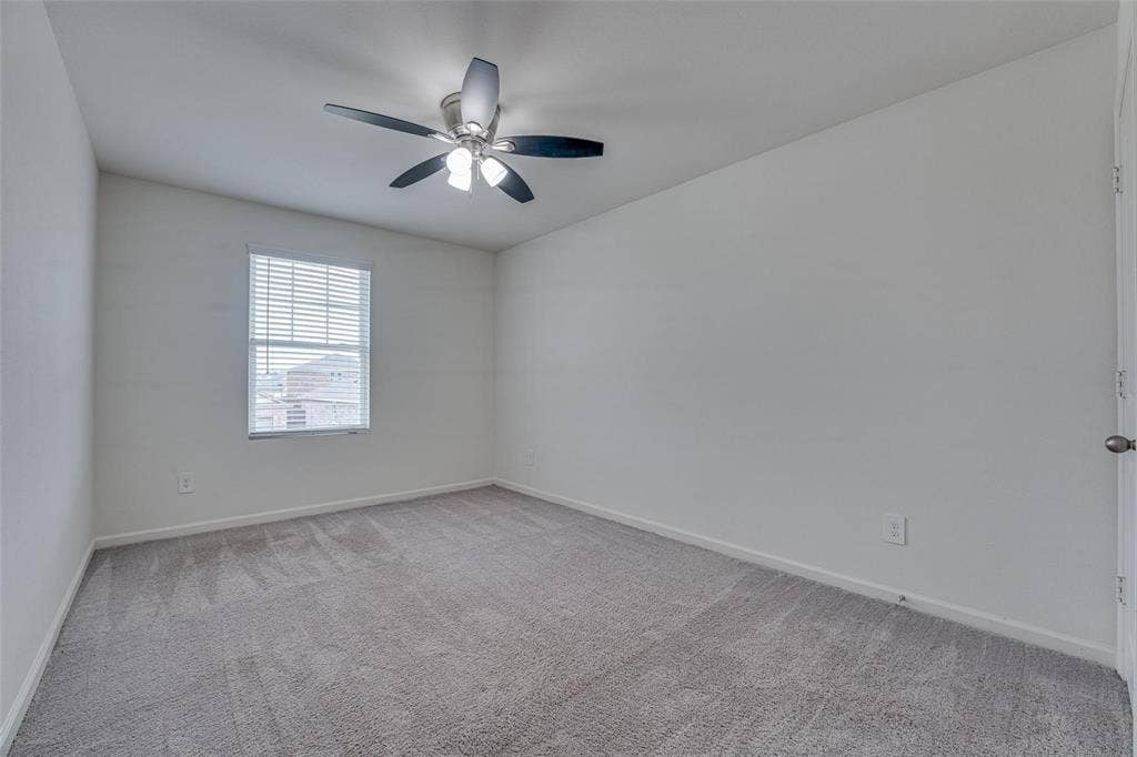 767 Camden Drive, Lavon, TX 75166 Carpeted room with a ceiling fan light fixture and a window with blinds