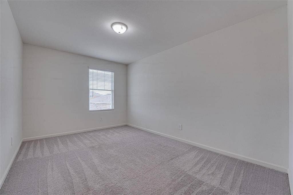 767 Camden Drive, Lavon, TX 75166 Neutral wall tones, carpeted flooring, window with blinds, and ceiling-mounted light fixture