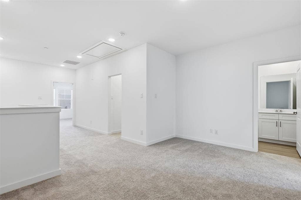 7621 Dakota, Watauga, TX 76148 Recessed lighting, carpet flooring, a white window frame, and a white vanity with a rectangular sink