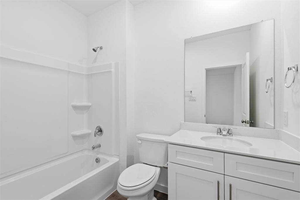 7621 Dakota, Watauga, TX 76148 White vanity with a light-toned countertop and an integrated sink