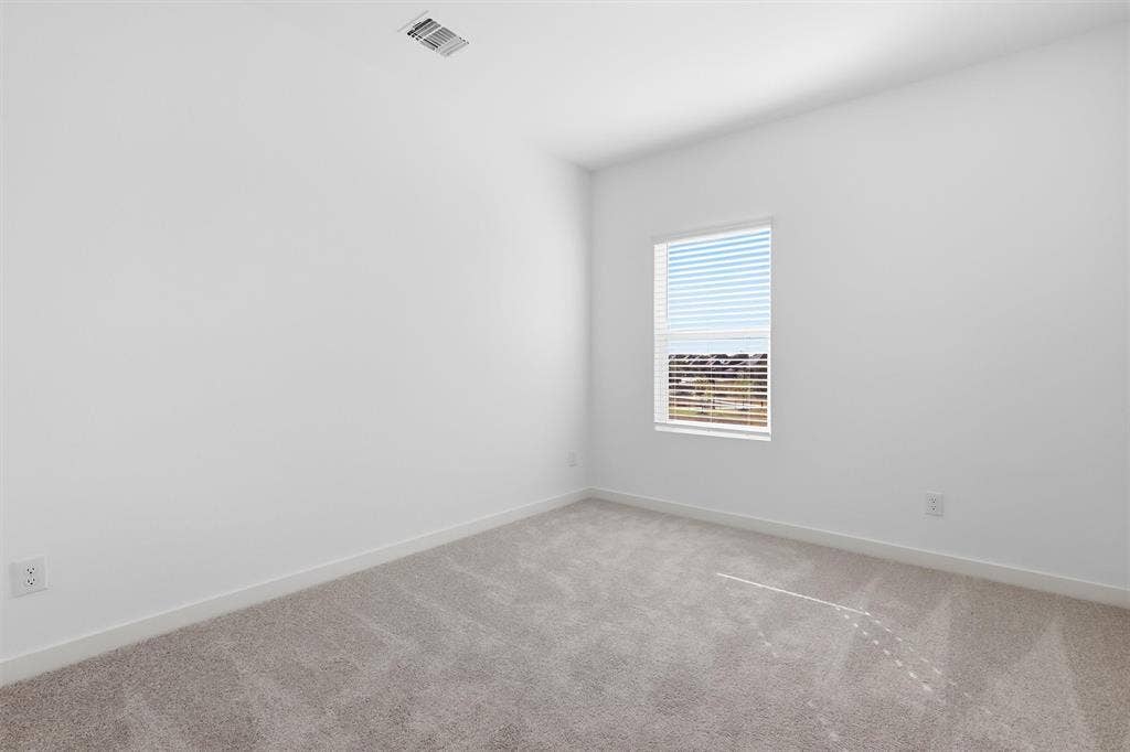 7621 Dakota, Watauga, TX 76148 Recessed window with horizontal blinds, light gray wall-to-wall carpeting, and white painted walls