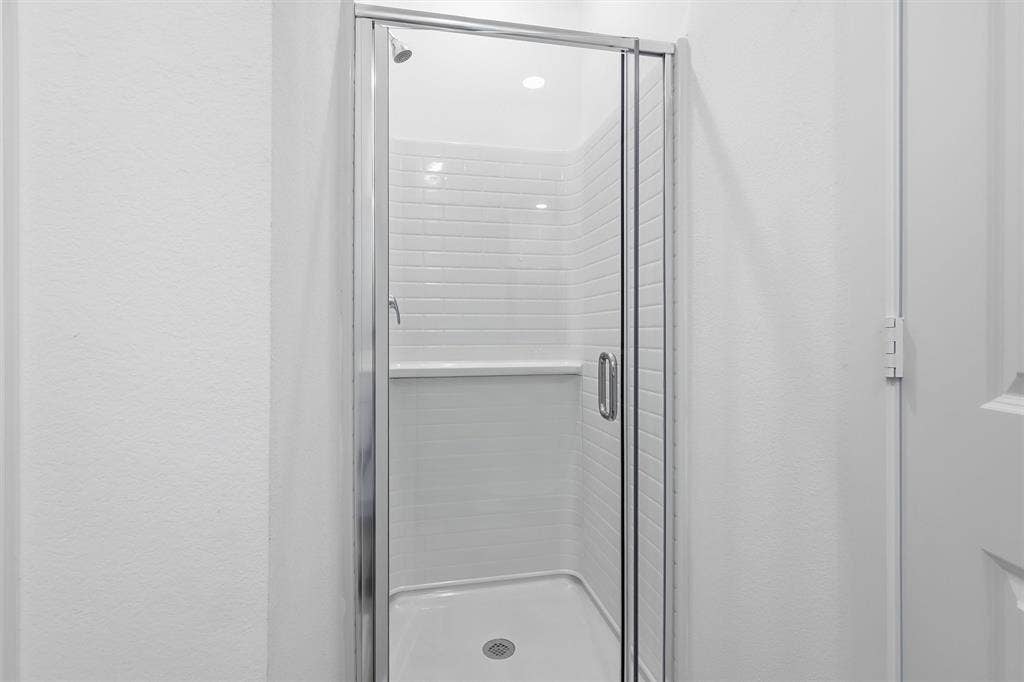 7621 Dakota, Watauga, TX 76148 Walk-in shower with clear glass enclosure and chrome hardware