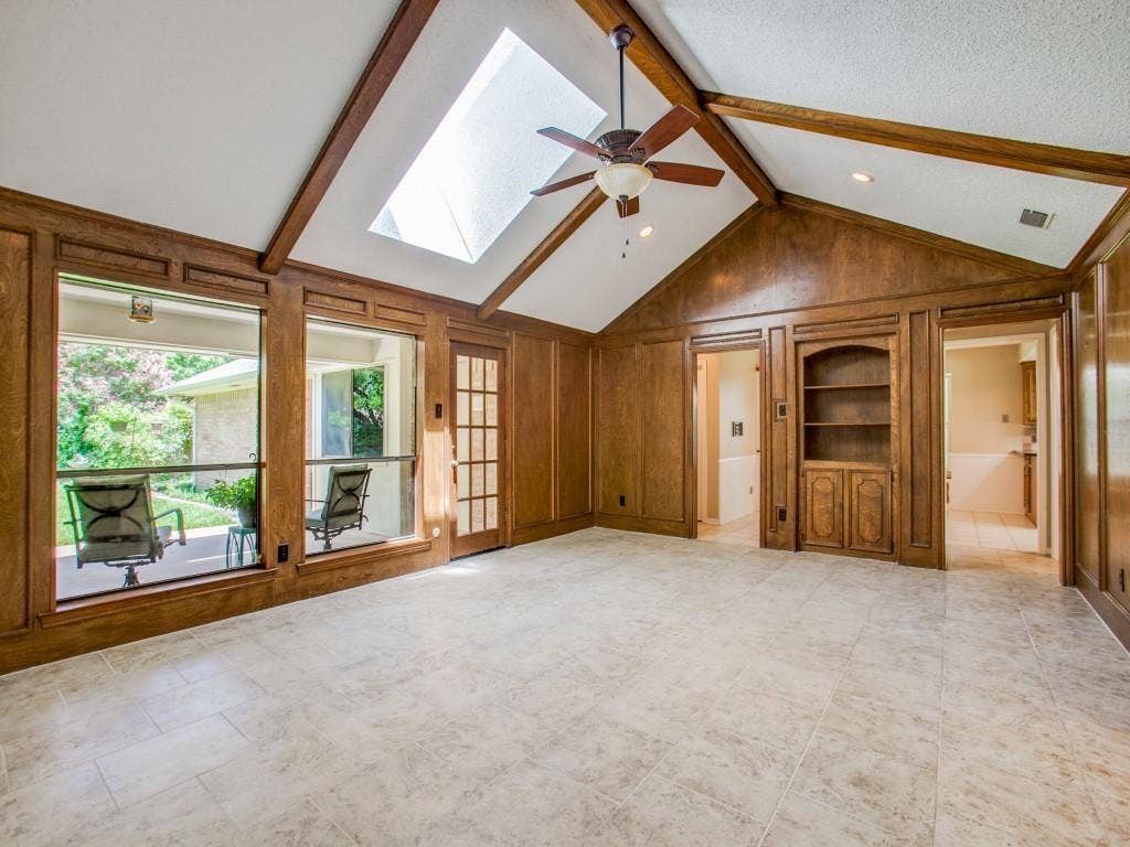 1103 Sundial Drive, Richardson, TX 75081 Vaulted ceiling with exposed wood beams, skylight, and ceiling fan