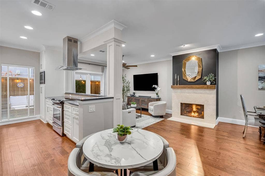 4242 Travis Street, #102, Dallas, TX 75205 Open floor plan with living, dining, breakfast room/bar, kitchen and bathroom.