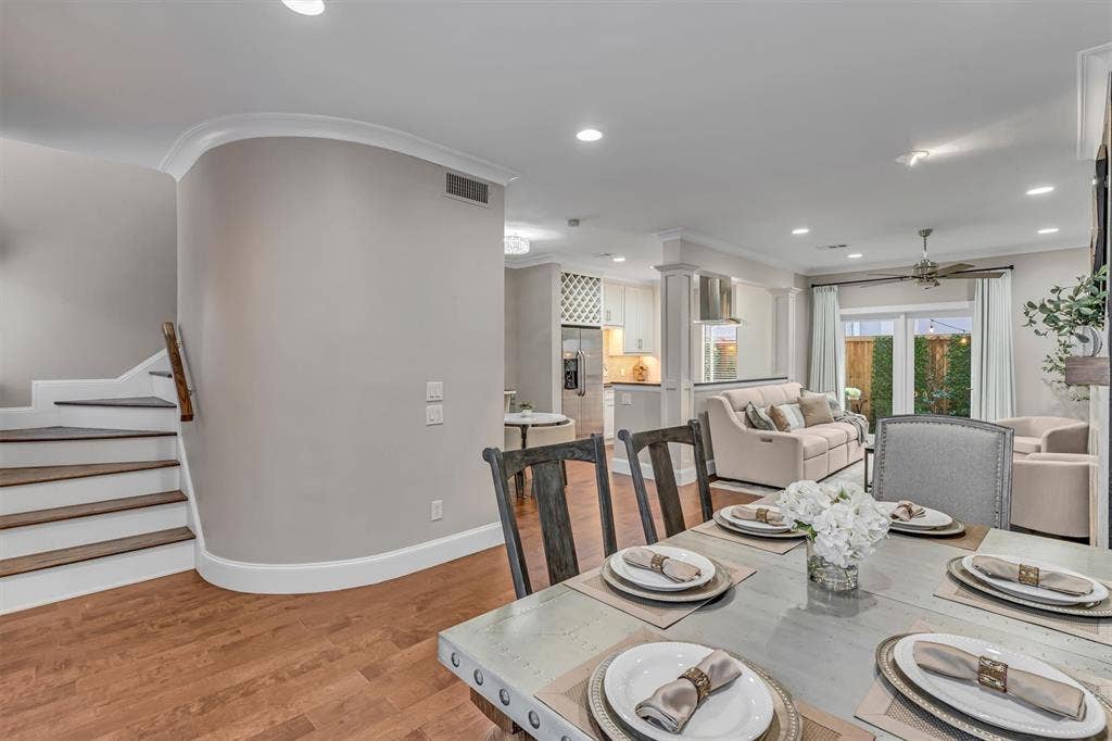 4242 Travis Street, #102, Dallas, TX 75205 Hardwood-finish flooring throughout, recessed ceiling lighting, crown molding, and a staircase.