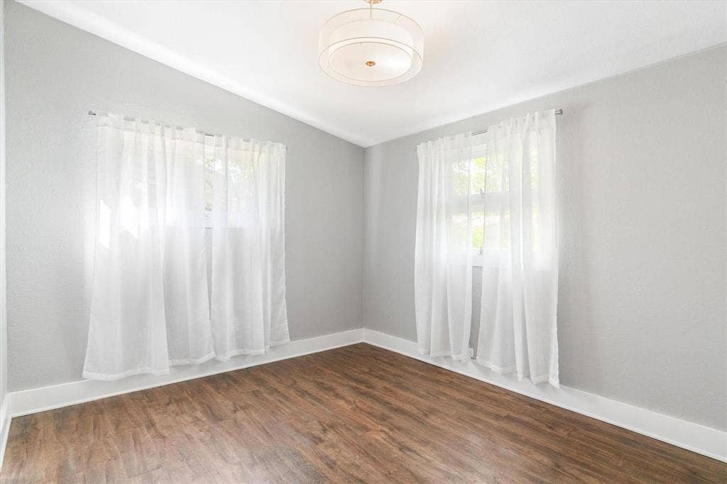 230 Shady Shores Drive, Mabank, TX 75156 Neutral wall tones, wood-finish flooring, and white trim