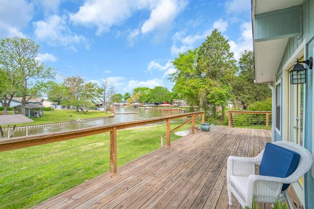 230 Shady Shores Drive, Mabank, TX 75156 Expansive wood deck with cable railing overlooking a canal
