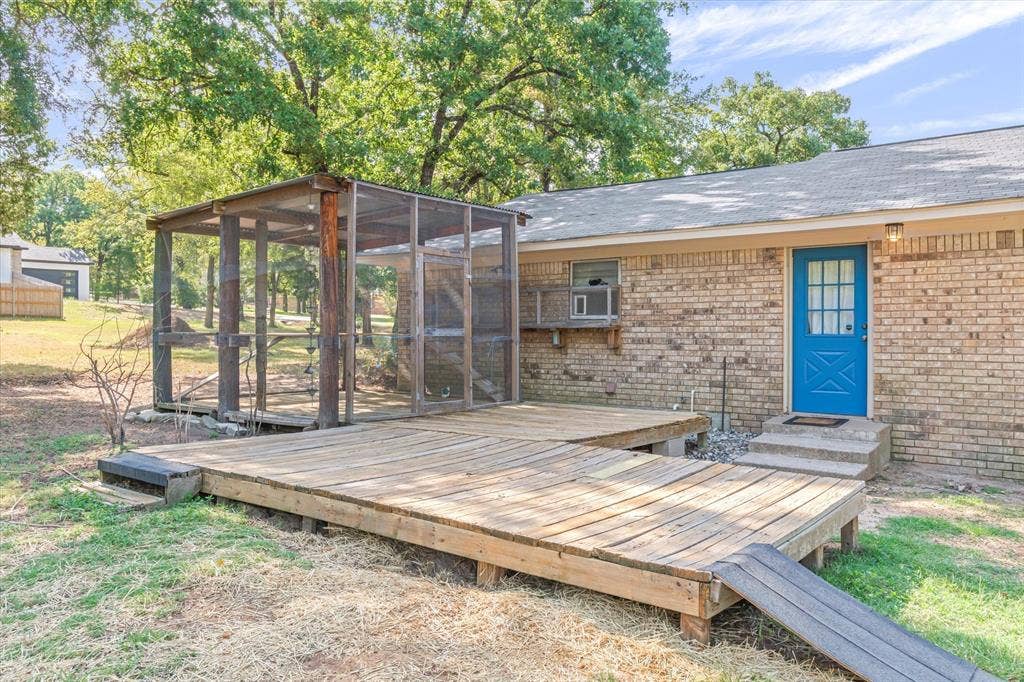 2941 Trey Circle, Athens, TX 75752 Back deck is perfect for your backyard BBQ. Includes a kennel or chicken coop