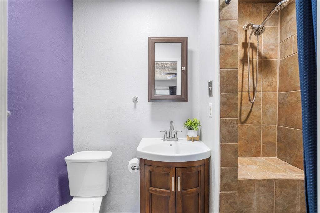 2941 Trey Circle, Athens, TX 75752 Ensuite bath has a walk in tiled shower with a seat
