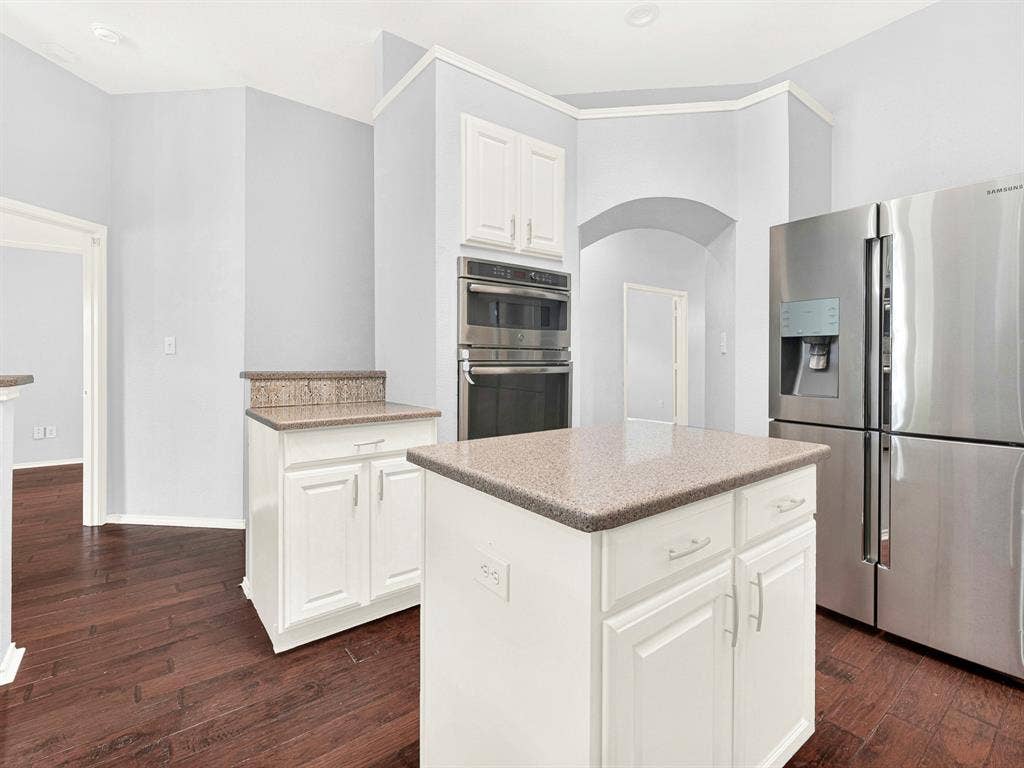 7409 High Point Drive, Sachse, TX 75048 Granite countertops, stainless steel appliances, and center island