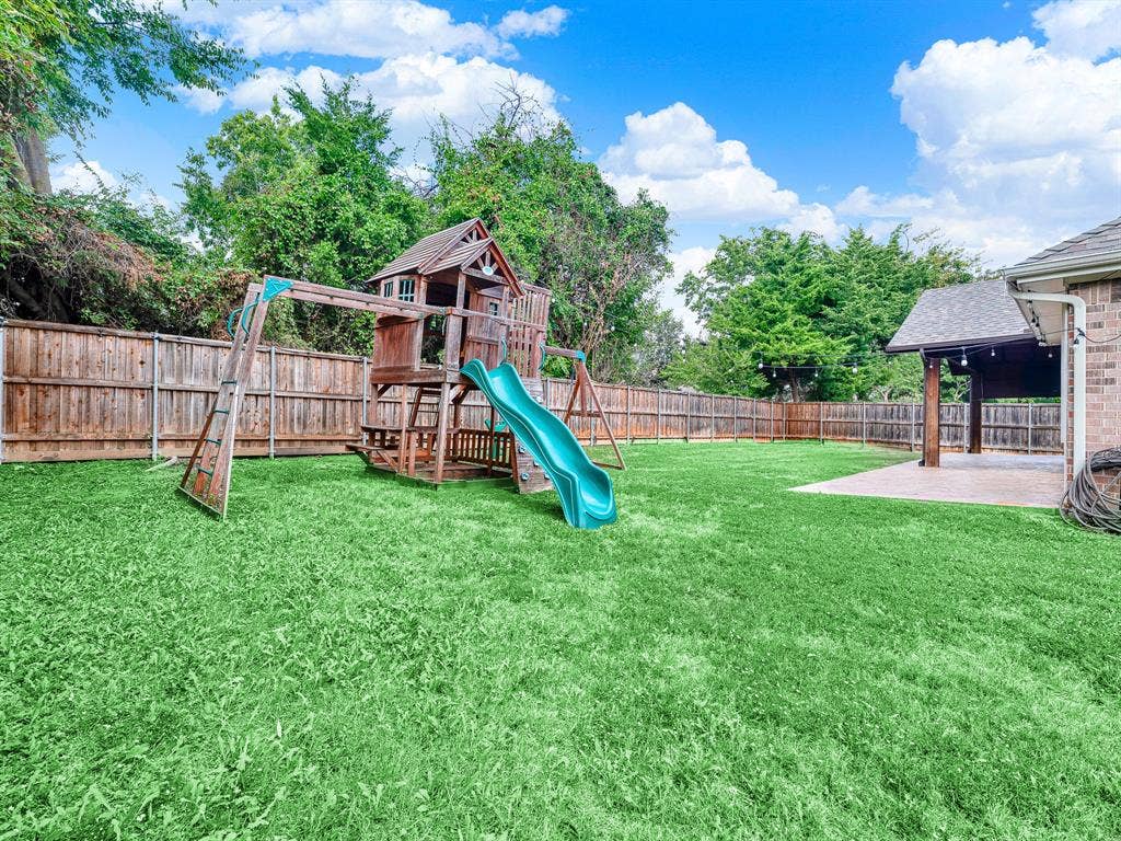 7409 High Point Drive, Sachse, TX 75048 Custom built playground in a private backyard
