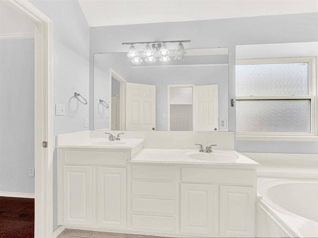7409 High Point Drive, Sachse, TX 75048 Clean white color palette with dual sinks