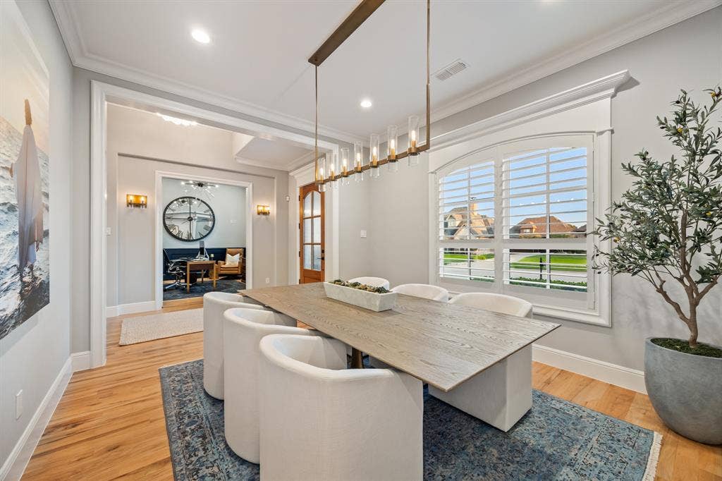 2201 Hanna Court, Midlothian, TX 76065 Formal dining space tucked beside the kitchen, with yard views through oversized windows.