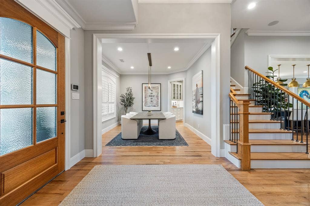 2201 Hanna Court, Midlothian, TX 76065 Formal dining room opens off the foyer, framed by an oak staircase and warmed by natural light.