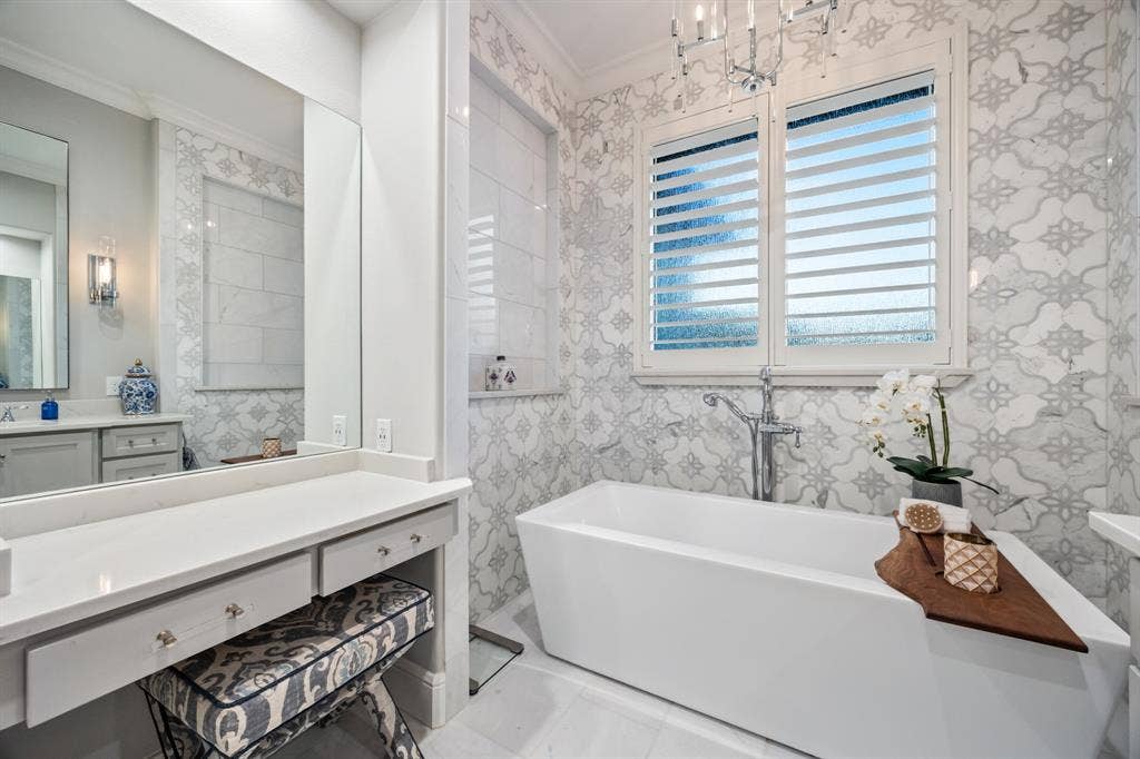 2201 Hanna Court, Midlothian, TX 76065 Dual vanities and custom tile carry the primary bath's spa feel throughout.