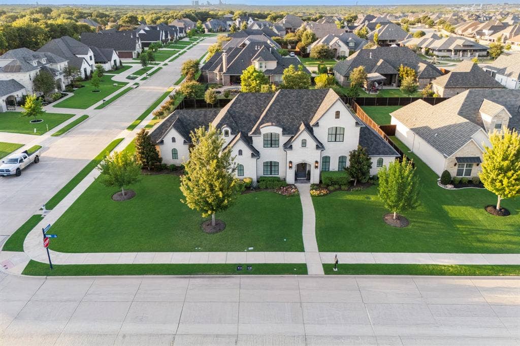 2201 Hanna Court, Midlothian, TX 76065 Aerial perspective shows the home's prime corner lot placement on a quiet street in Somercrest.