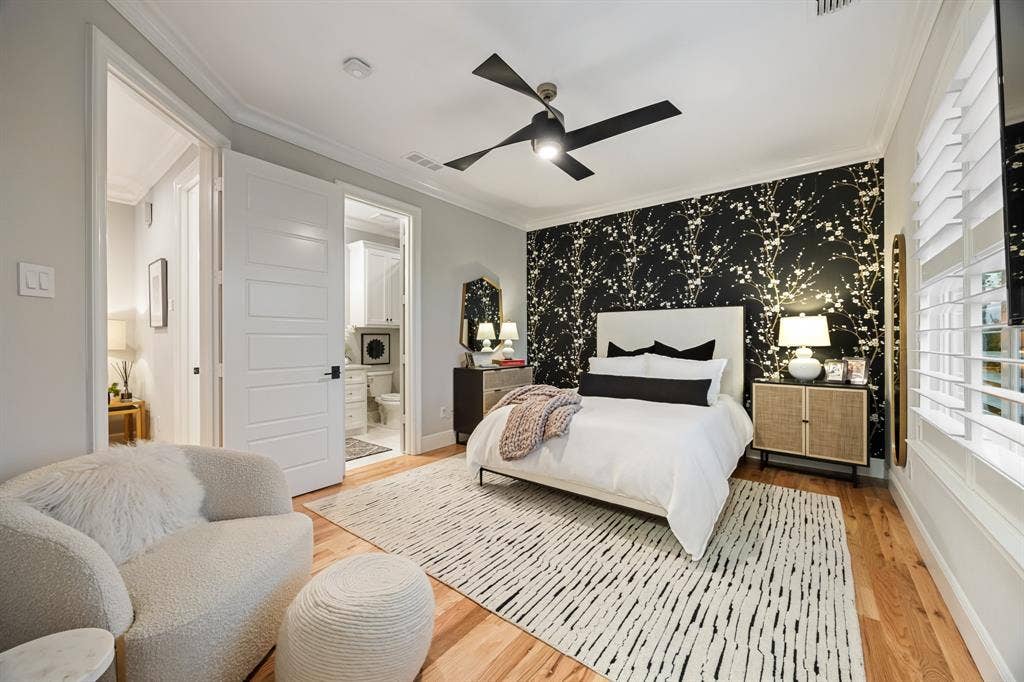 2201 Hanna Court, Midlothian, TX 76065 Upstairs bedroom finished with oak hardwood flooring and a bold accent wall.