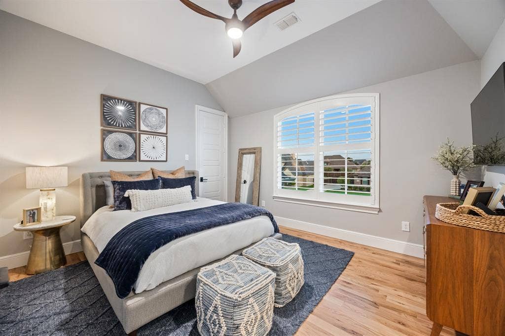 2201 Hanna Court, Midlothian, TX 76065 Bright upstairs bedroom with oak hardwood floors and picture-window views.