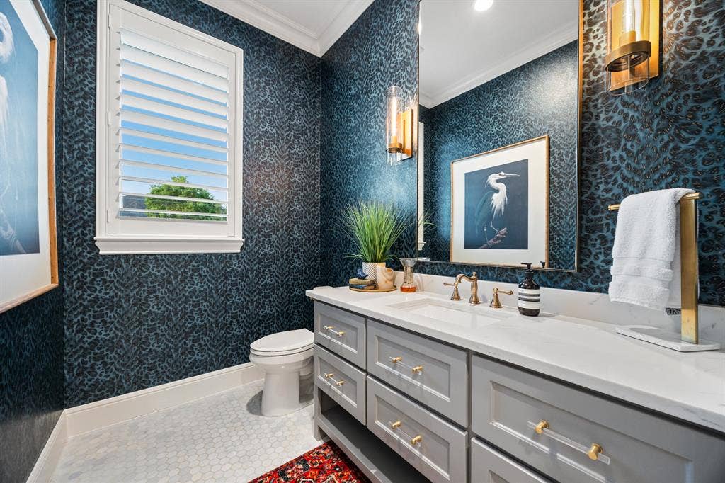 2201 Hanna Court, Midlothian, TX 76065 Guest bath detailed with moody designer wallpaper and a statement round mirror.