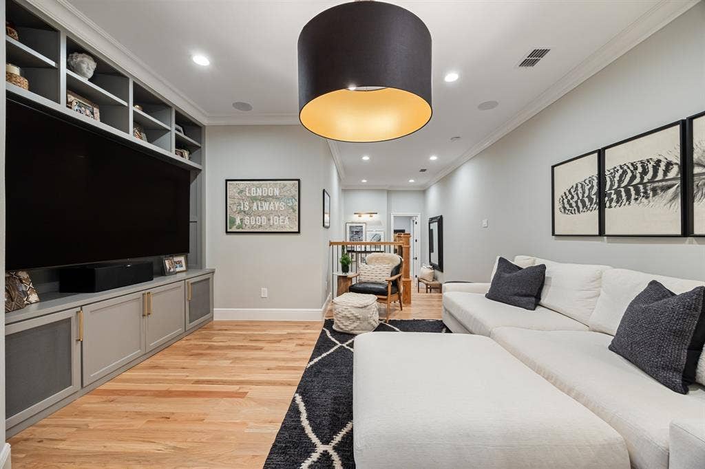2201 Hanna Court, Midlothian, TX 76065 Family loft finished with custom built-ins and surround sound, made for movie nights.