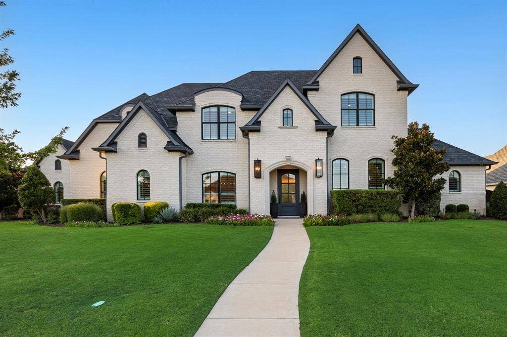 2201 Hanna Court, Midlothian, TX 76065 Custom Troy Priddy home makes a striking first impression with its stone-and-stucco facade.