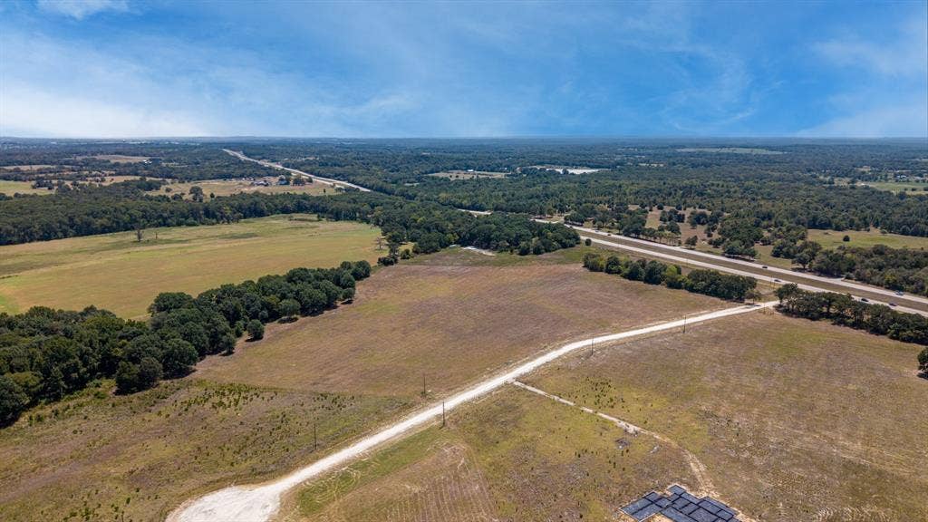 Lot 6 E US HWY 175, Athens, TX 75752 Expansive acreage featuring a natural tree line, partial pasture, and direct access to a paved road