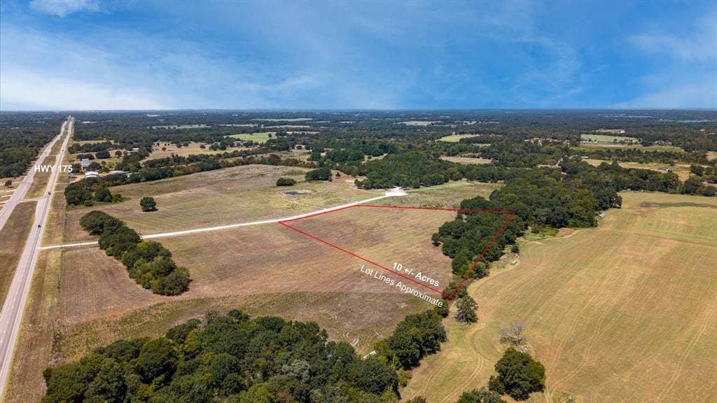 Lot 6 E US HWY 175, Athens, TX 75752 Expansive 10± acre parcel featuring varied terrain, mature trees, and direct frontage on HWY 175