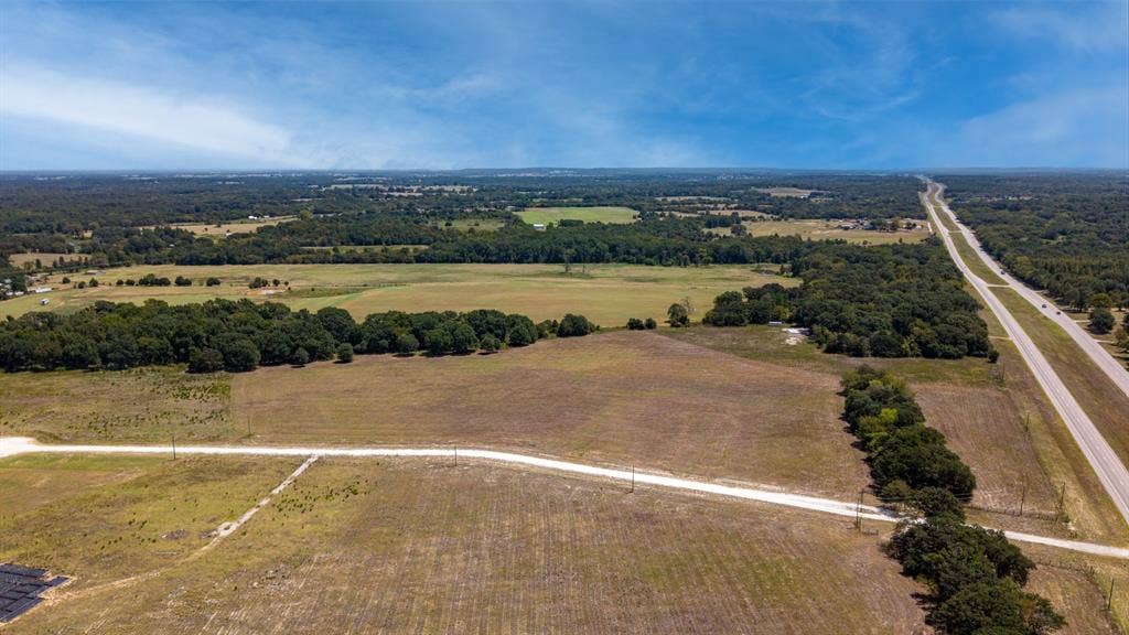 Lot 6 E US HWY 175, Athens, TX 75752 Expansive land parcel featuring a main highway and secondary road access