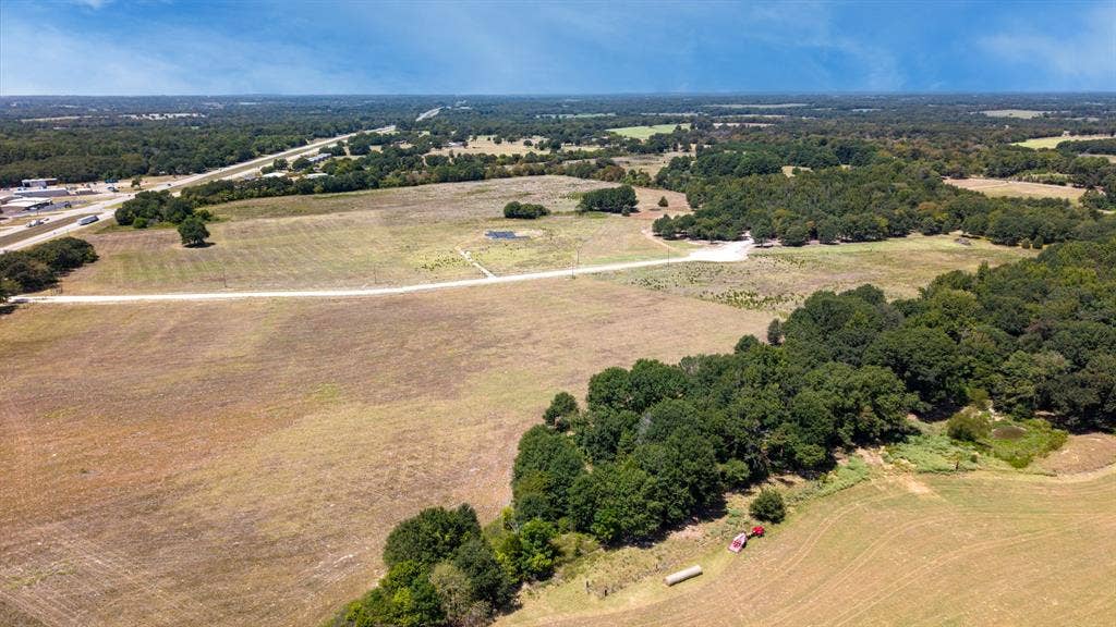Lot 6 E US HWY 175, Athens, TX 75752 Expansive land offering a combination of open fields and mature tree lines