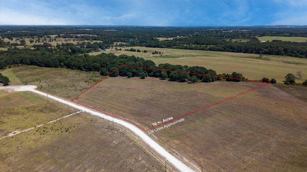 Lot 6 E US HWY 175, Athens, TX 75752 Expansive land parcel featuring 10+/- acres, a dirt road access, and wooded perimeter sections