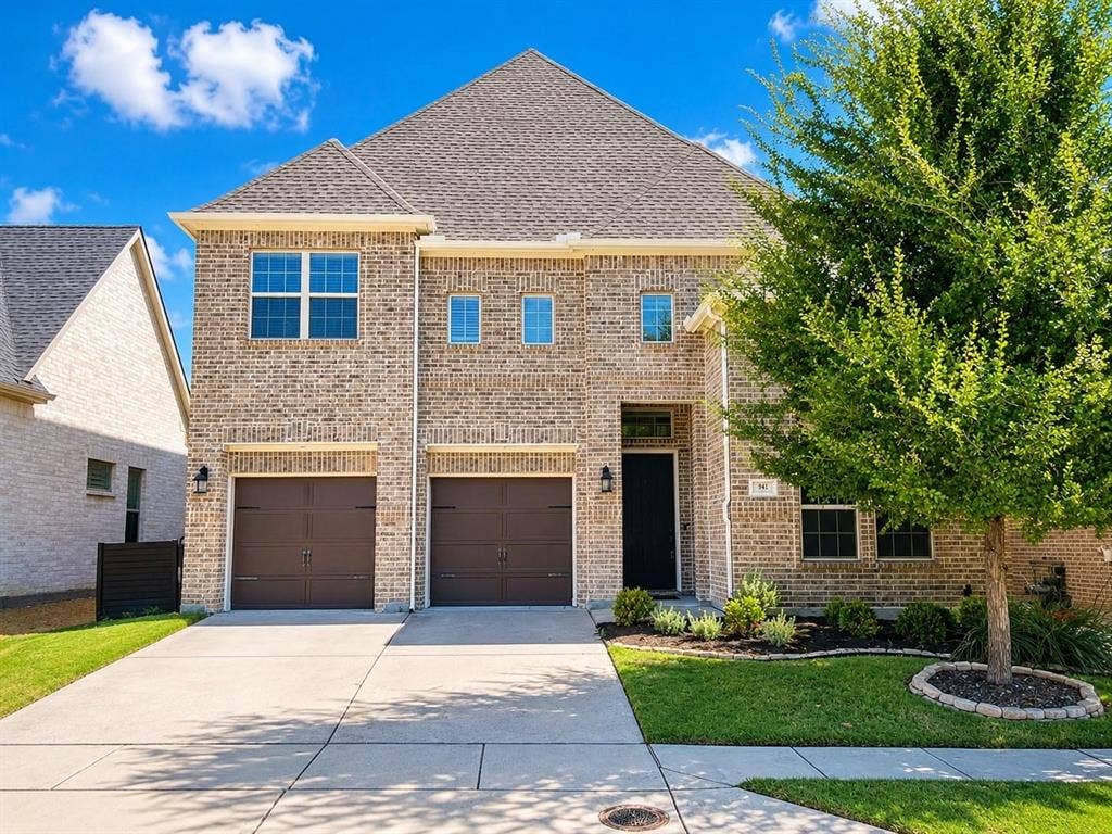 941 Leola Lane, Allen, TX 75013 Two-story brick exterior with a multi-gable roof, a two-car garage, established front landscaping, and a concrete driveway